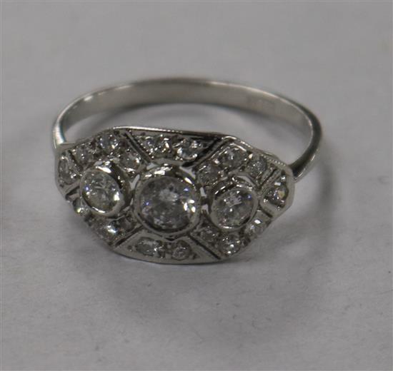 A modern 1920s/1930s style 18ct white gold and diamond cluster dress ring, size N.